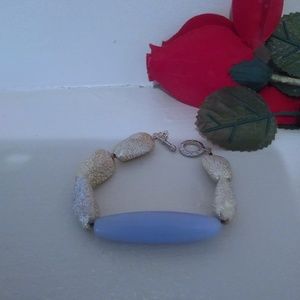 Light blue and gold colored bracelet